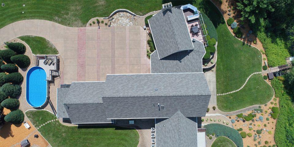Complete asphalt roof replacement completed on this Chippewa Falls home using premium architectural asphalt shingles. A professionally installed roofing system provides dependable protection, improved curb appeal, and lasting performance through Wisconsin's changing seasons. At Rock & Tait, every roof replacement is completed with careful attention to detail and quality craftsmanship. photo