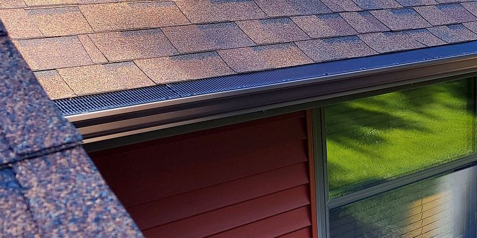 Architectural shingles and seamless gutters work together to protect this Menomonie home from water damage and harsh Wisconsin weather. Proper drainage is one of the most important factors in maintaining a long-lasting residential roofing system. photo
