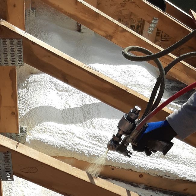 The best time to improve your attic insulation is during a roof replacement when the attic is easily accessible. Spray foam insulation helps seal air leaks, improve energy efficiency, reduce heating and cooling costs, and increase year-round comfort. photo