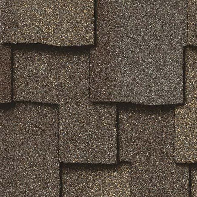 Designer asphalt shingles provide enhanced curb appeal while delivering dependable protection from wind, rain, snow, and ice. Premium roofing materials help homeowners enjoy both lasting beauty and long-term performance. photo