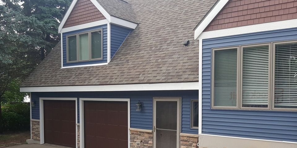 Combining complementary siding colors and architectural accents photo