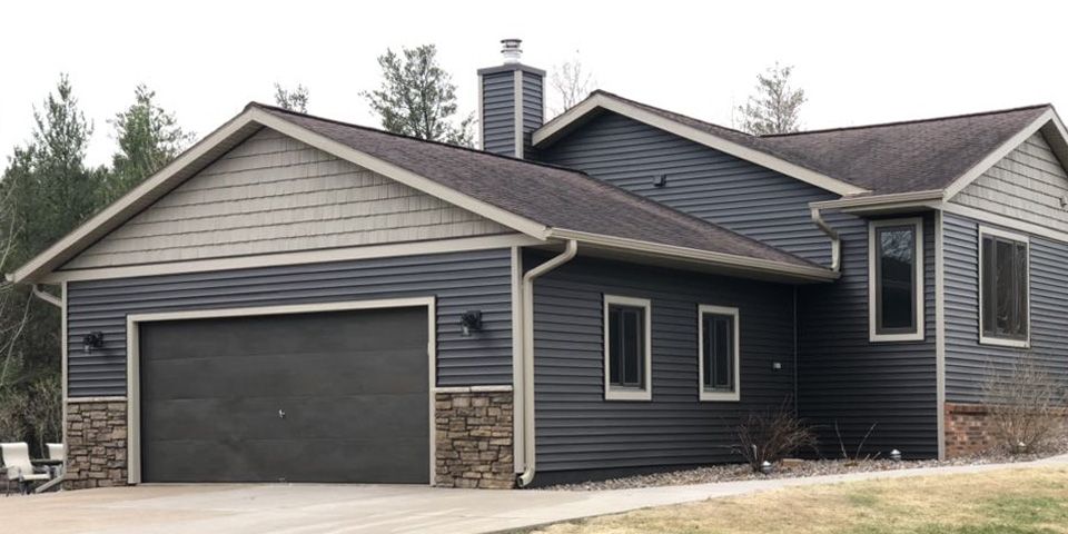 Quality siding protects far more than your home's appearance—it helps defend the entire building envelope from moisture and harsh weather. This completed siding replacement combines lasting durability with beautiful architectural design. photo